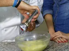 Kitchen Witch Smood potato masher & Garject garlic press - archival photograph